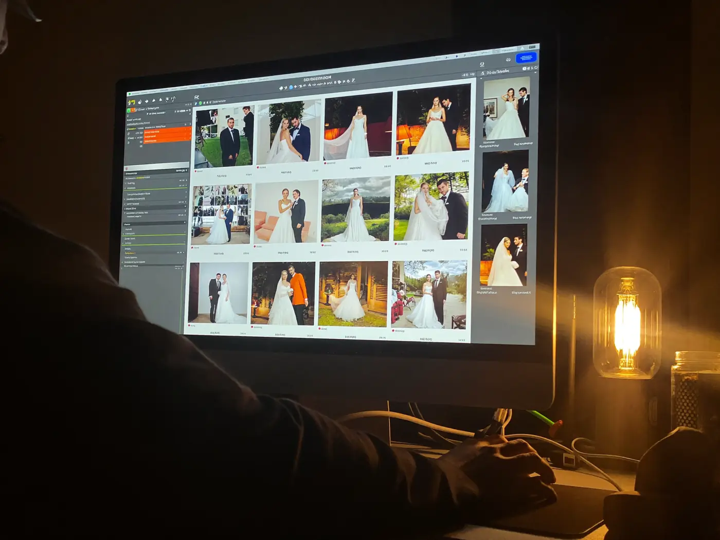 An editor going through a wedding gallery at a desk